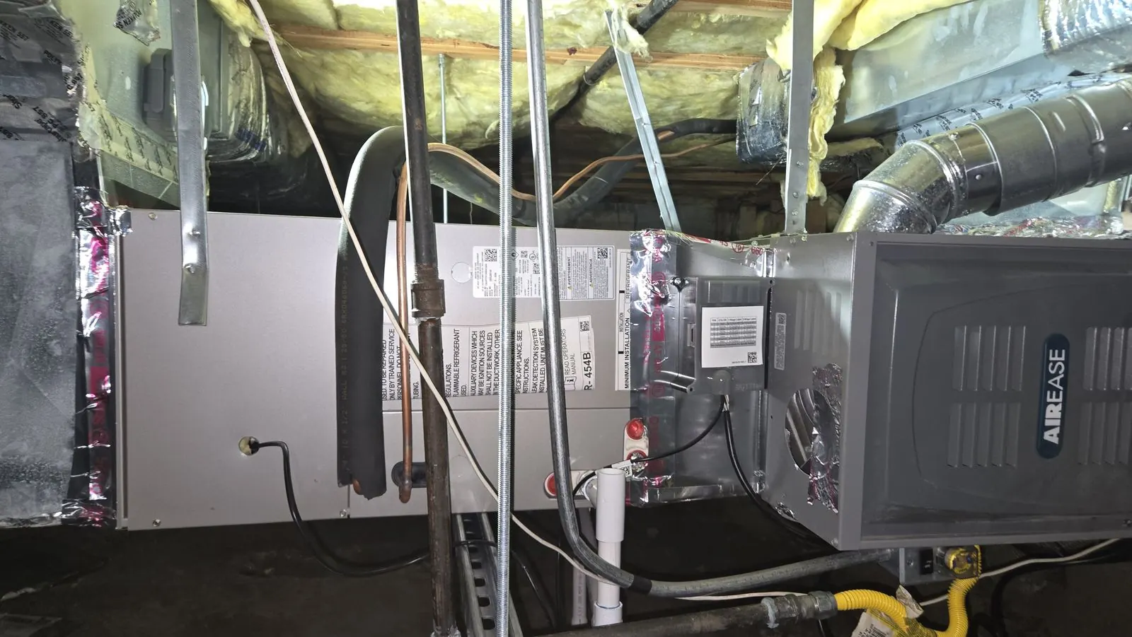 AirEase horizontal furnace installed between ceiling joists
