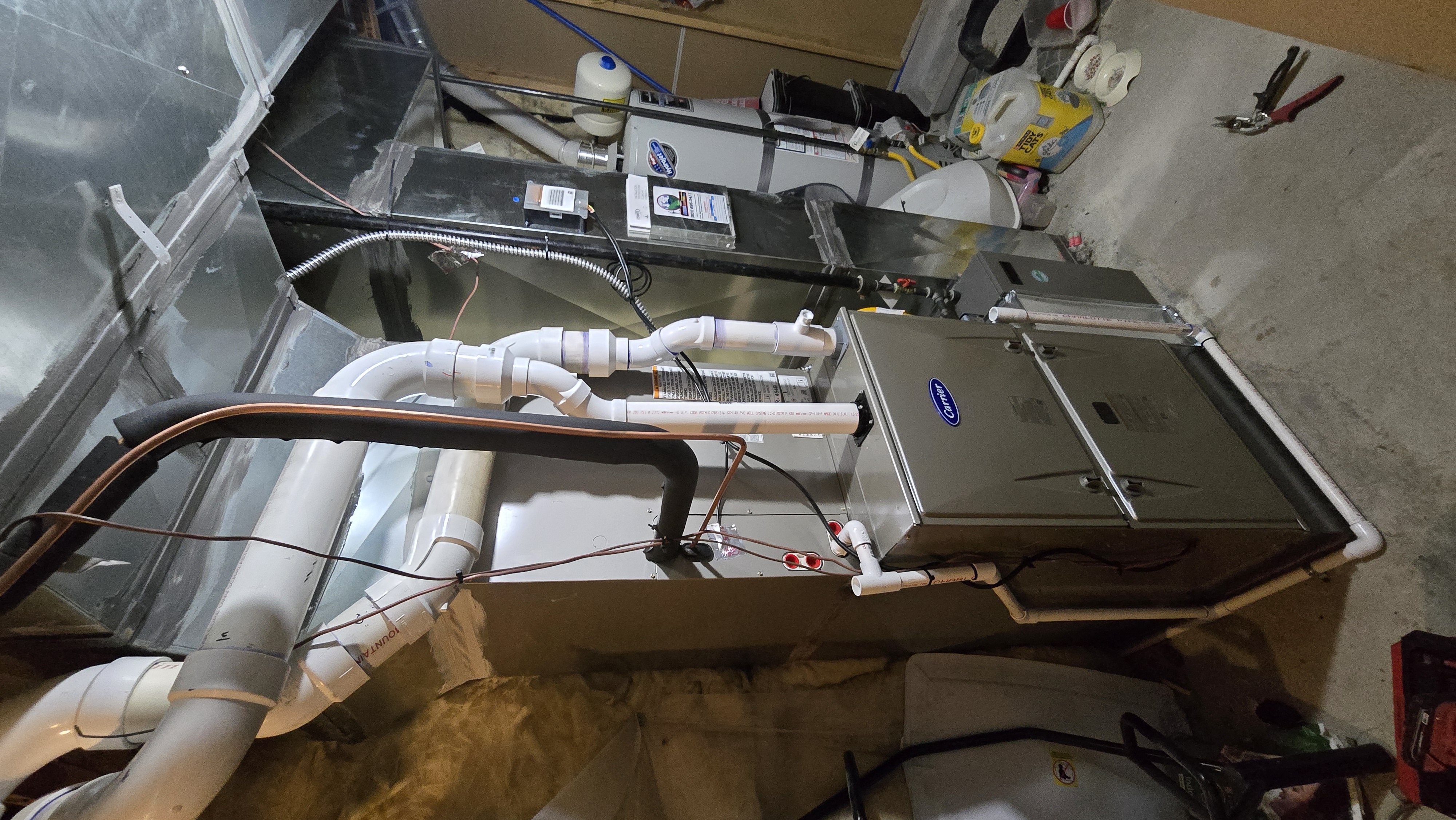 Professional HVAC technician inspection setup on residential heating and cooling units
