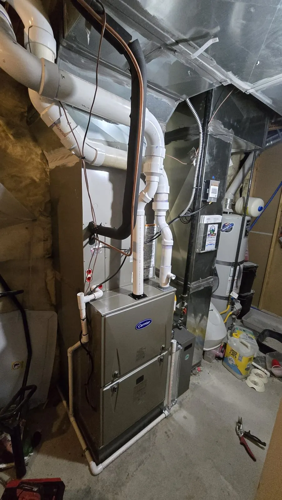 Carrier gas furnace in a residential utility room