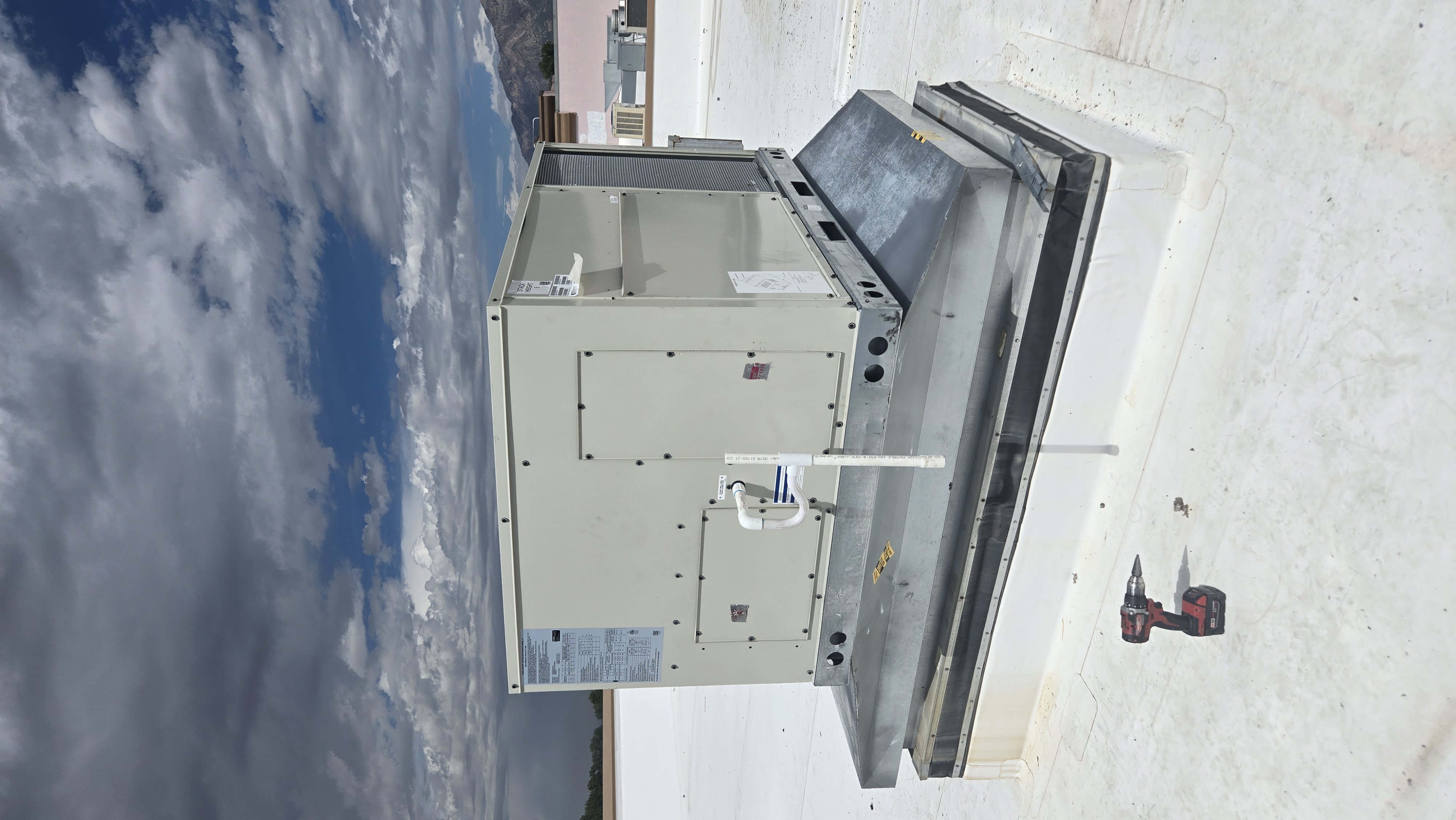 Commercial rooftop packaged HVAC unit undergoing diagnostic repair service in Northern Utah